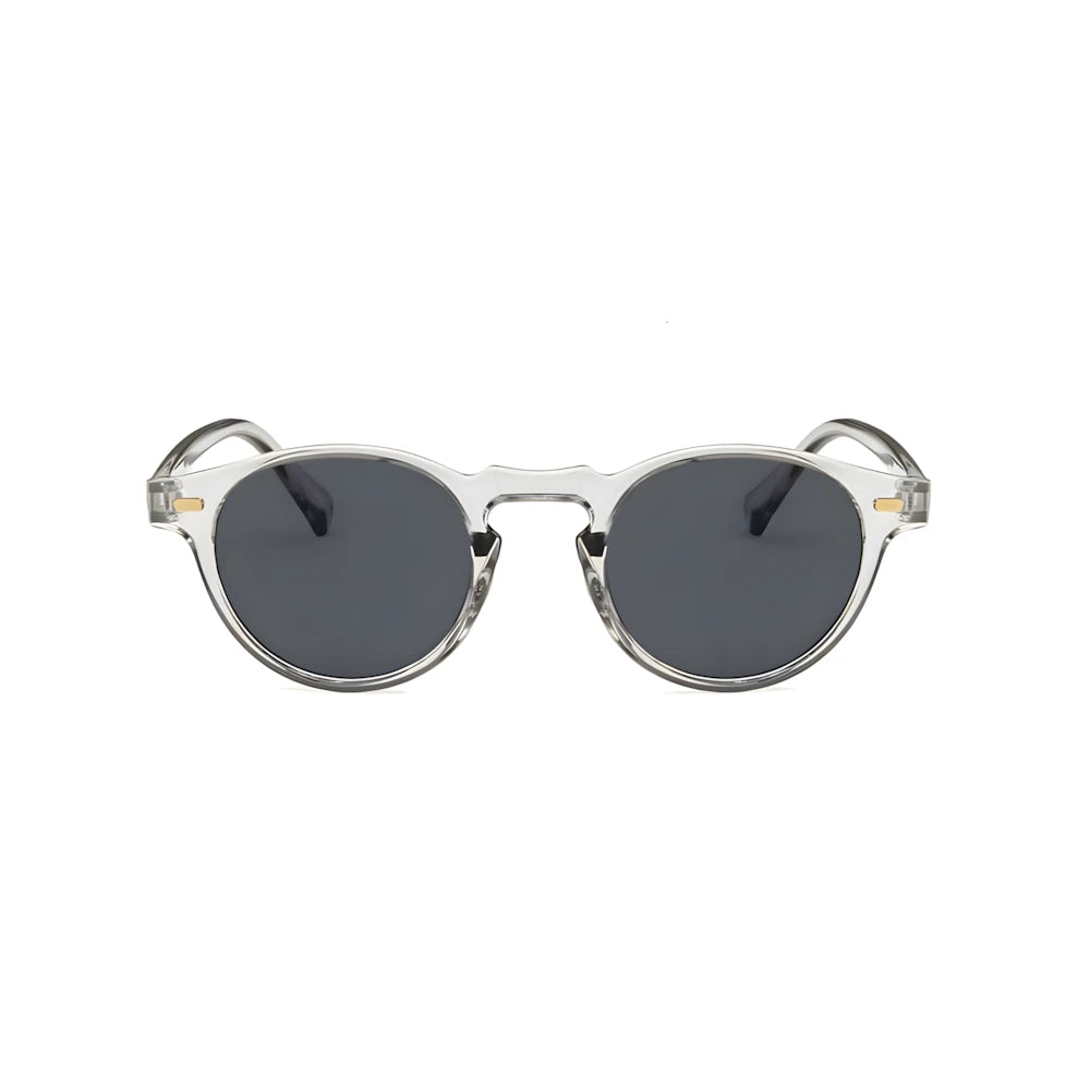 Translucent round acetate sunglasses with crystal frame and black polarized lenses, front view — HARO Côte d'Azur Èze