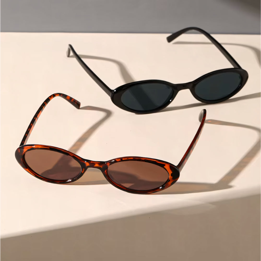 Oval cat-eye acetate sunglasses with white frame and black polarized lenses, front view — HARO Forte dei Marmi